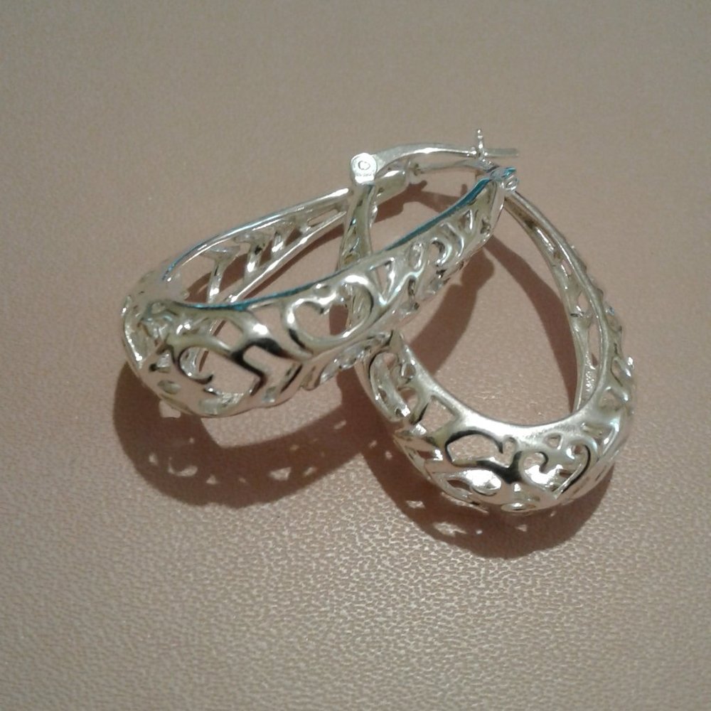 Solid stamped 925 sterling silver hoop earrings. New , never worn.